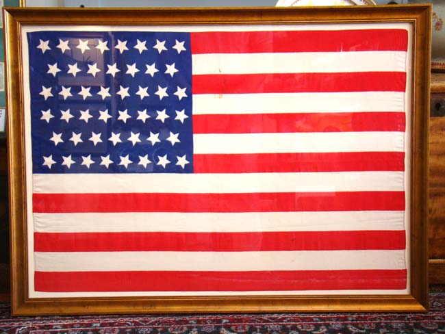 A beautiful circa 1908 American flag with 46 stars in the 'dancing stars' pattern